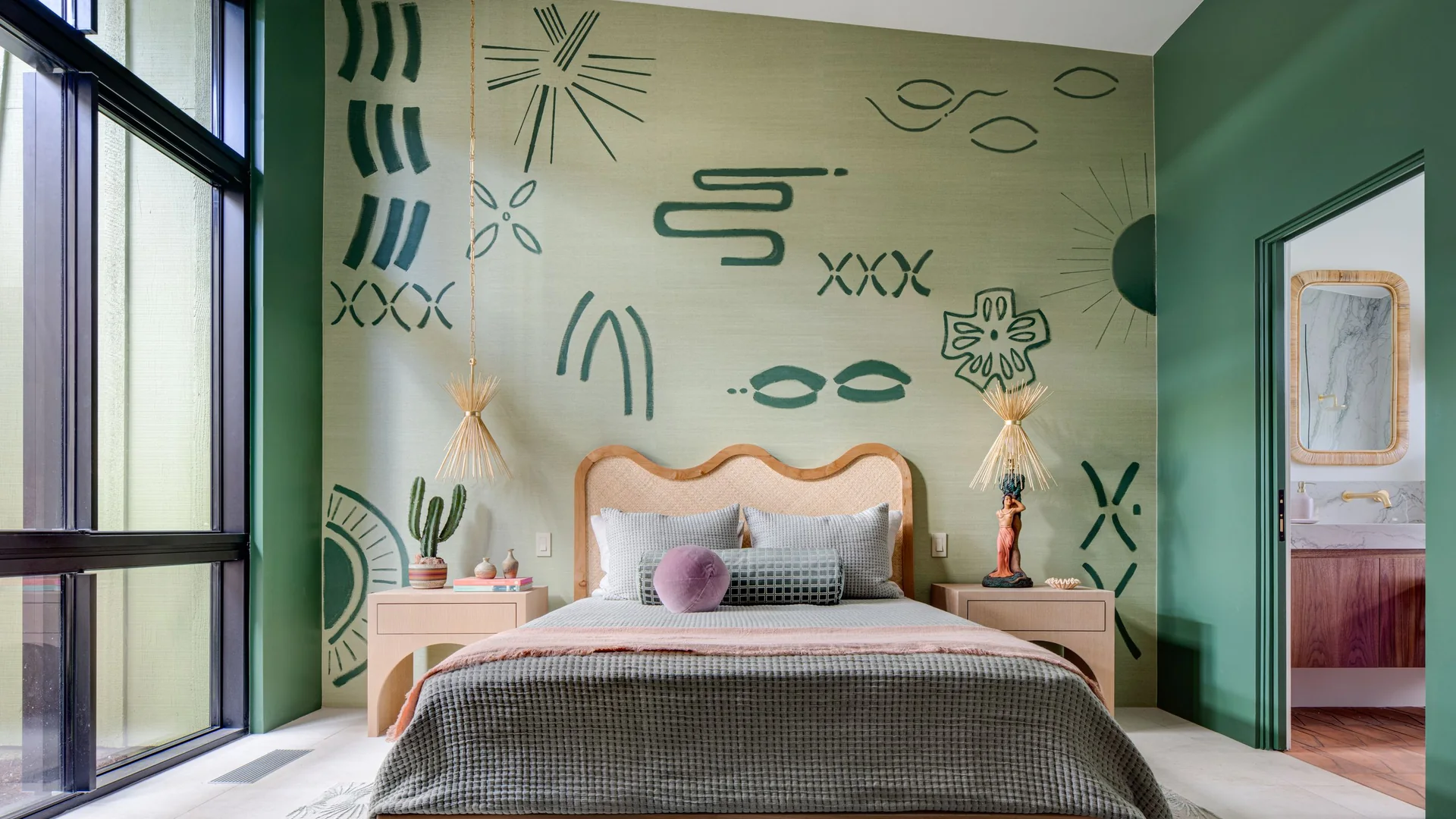 Calm bedroom with an expressive pale botanical feature wall behind the bed